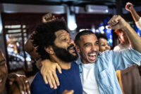 sports and football fans watching a game and cheering